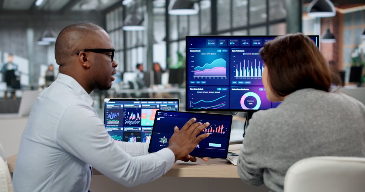 Business analyst examining KPI dashboards